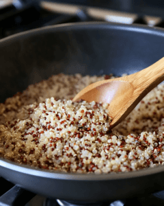 Raw quinoa seeds next to grains.