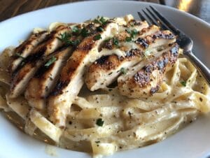 Fettuccine Alfredo with grilled chicken slices