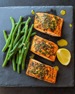 Keto-friendly air-fried salmon fillets with green beans and a touch of lemon juice