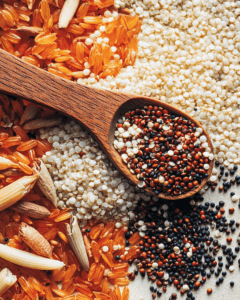 Raw quinoa seeds next to grains.